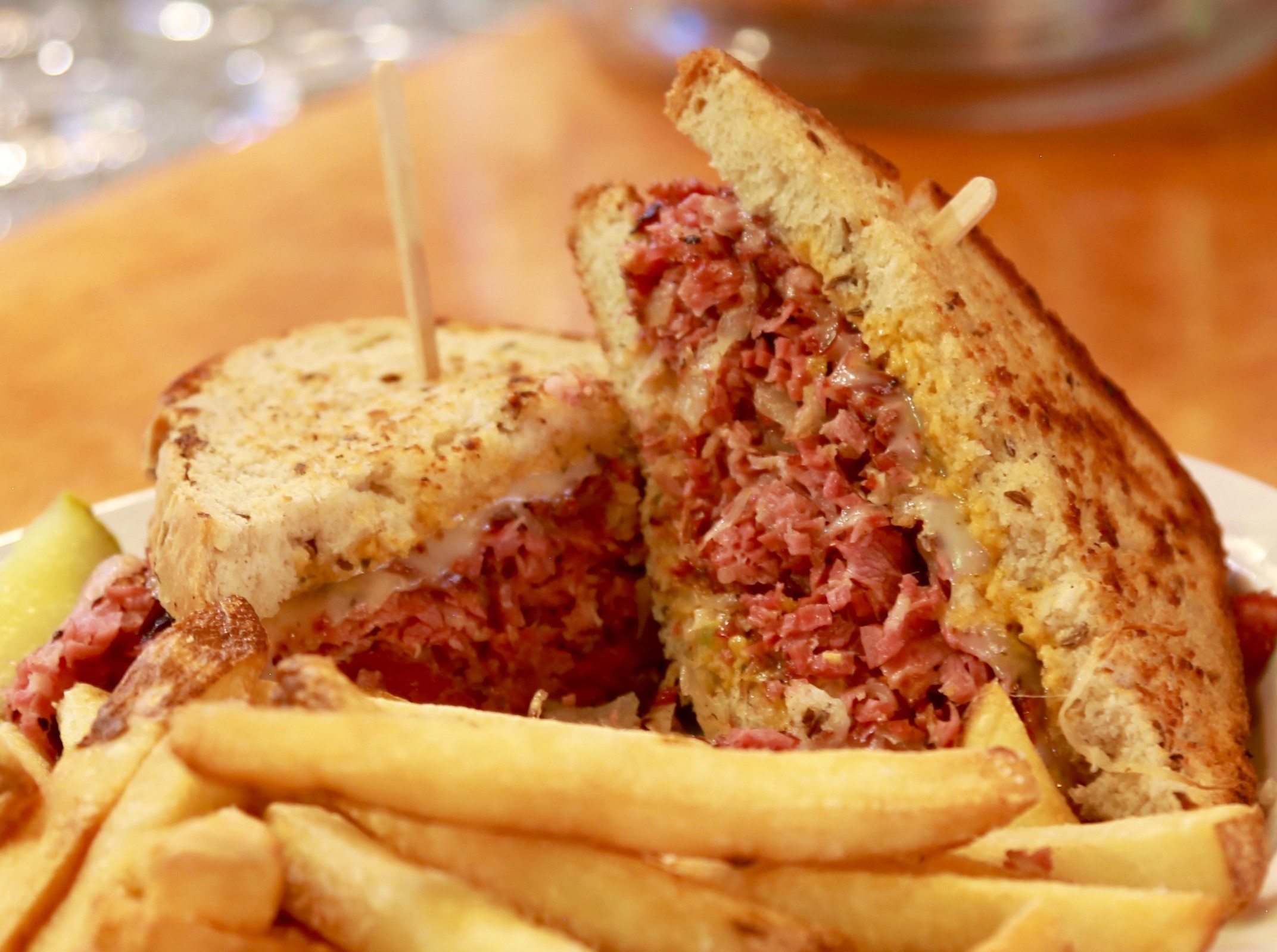 Reuben sandwich close-up with fries